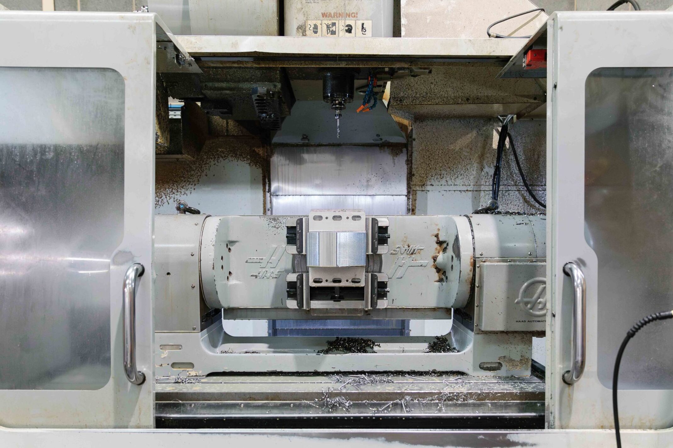 CNC milling machine producing precision component at B&B Precision Engineering