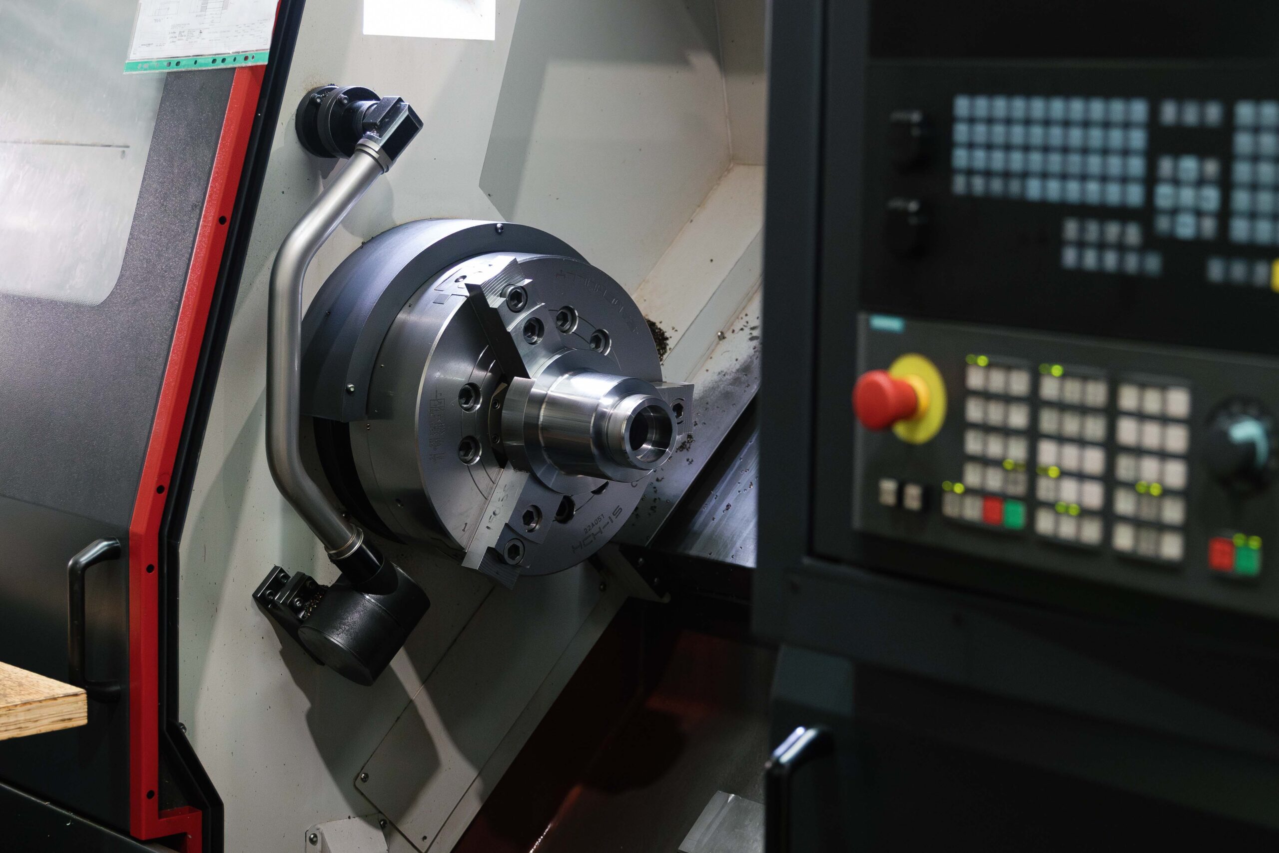 CNC machine producing precision turned component at B&B Precision Engineering